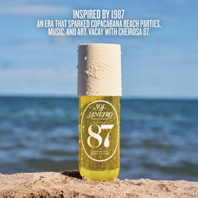Sol de Janeiro bottle placed on sand illustrating warm-sand scent inspiration