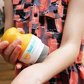 Solar Buddies being used on child's arm at the beach for quick protection