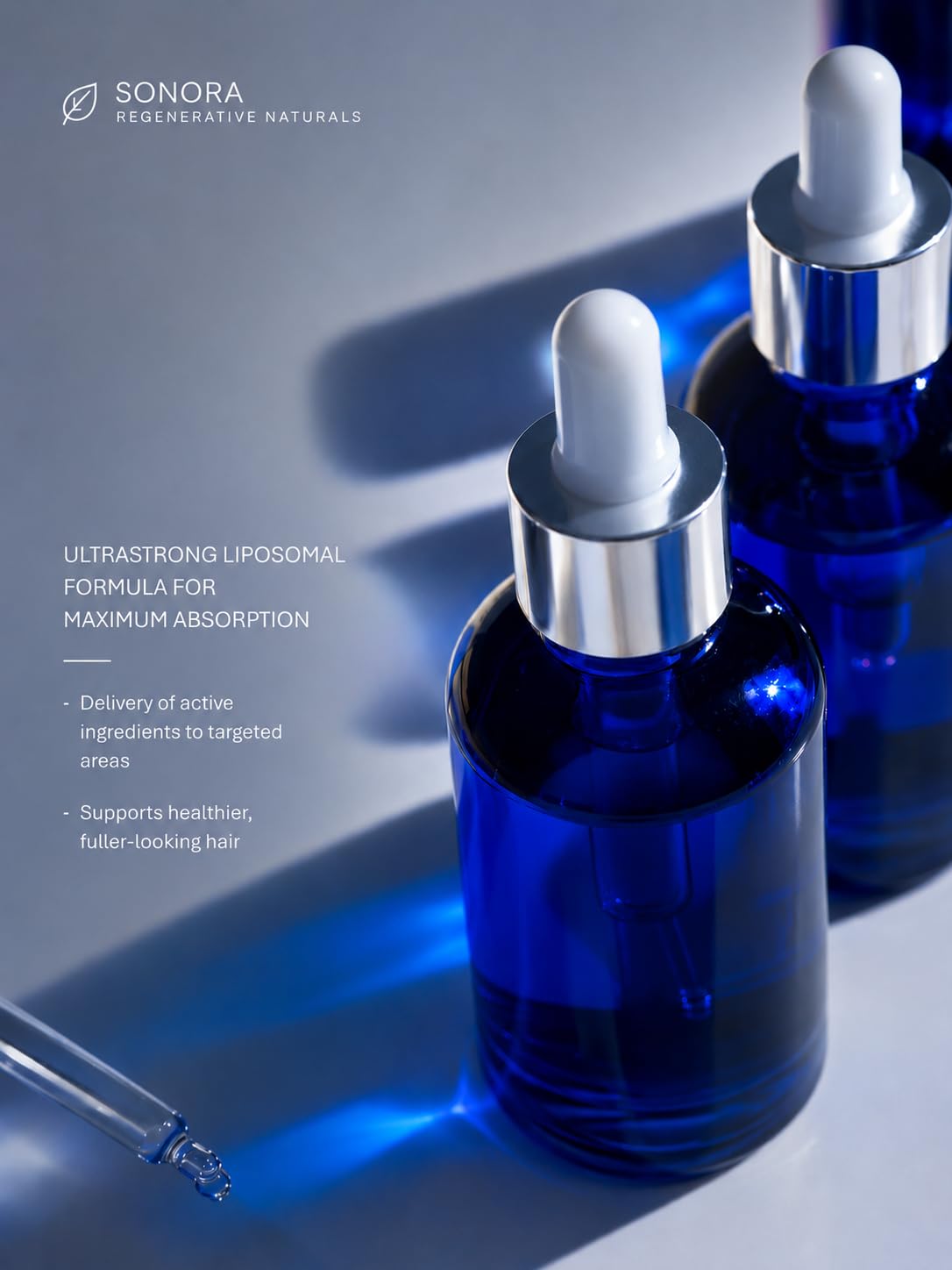Sonora Supply Co. bottle next to hand for size and scale, clear dosing benefit