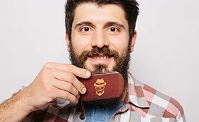 Sosoon brush used with beard oil spreading product evenly for softer facial hair