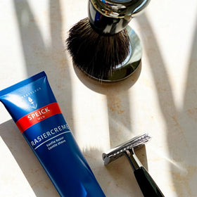 WALTER RAU Speick shave cream being whipped with brush for protective glide