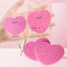 Spunspon sponge held in hand to show scale and easy grip for precise facial use