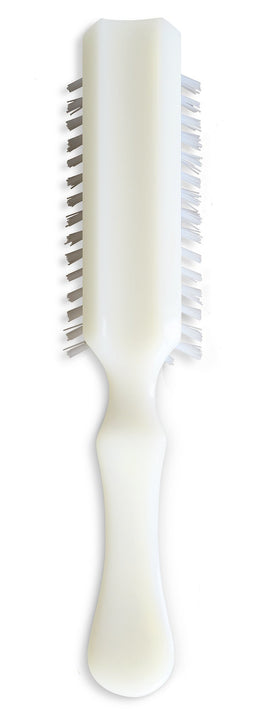 STANLEY HOME PRODUCTS brush in hand to show size and comfortable grip for travel