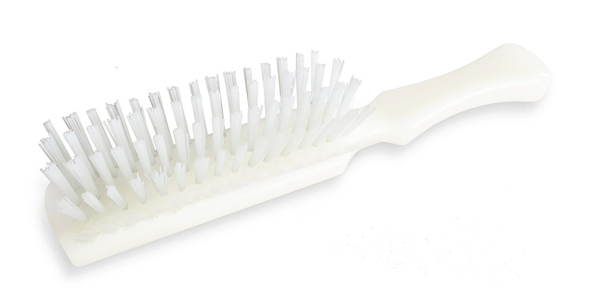STANLEY HOME PRODUCTS brush used on hair demonstrating detangling and smoothing benefit