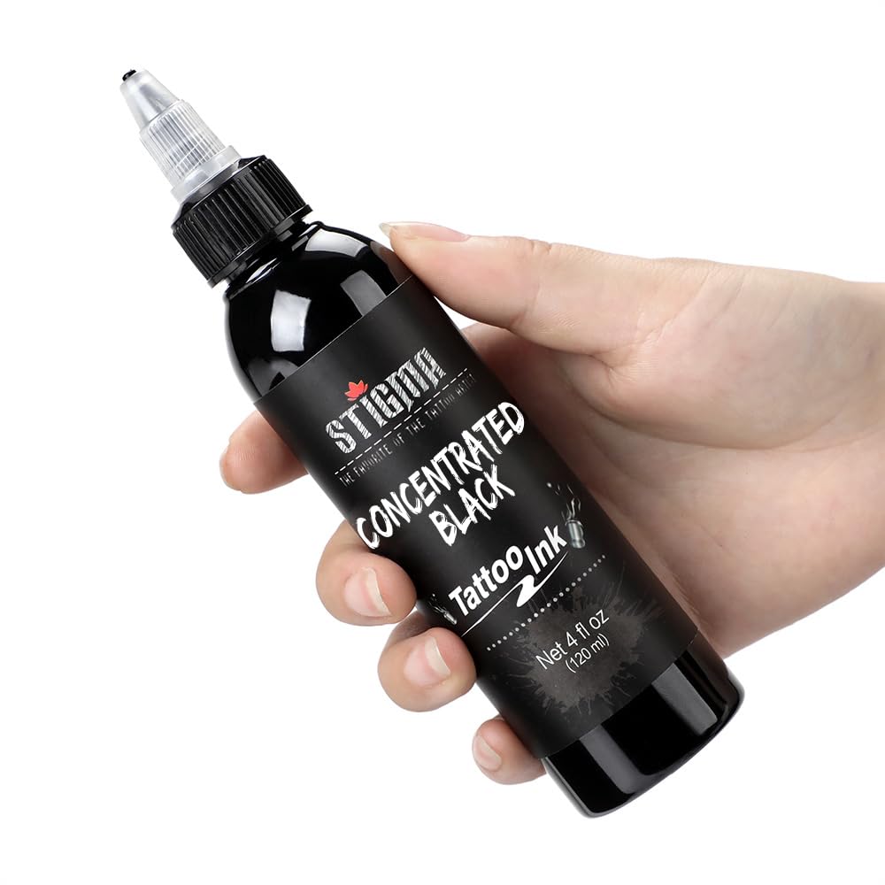STIGMA bottle on tattoo workstation in studio showing professional-ready pigment