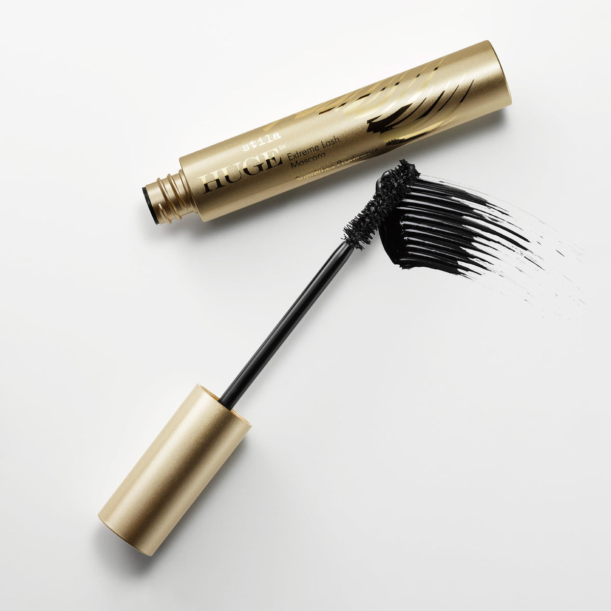 stila HUGE mascara wand close-up demonstrating curved bristles for full coverage