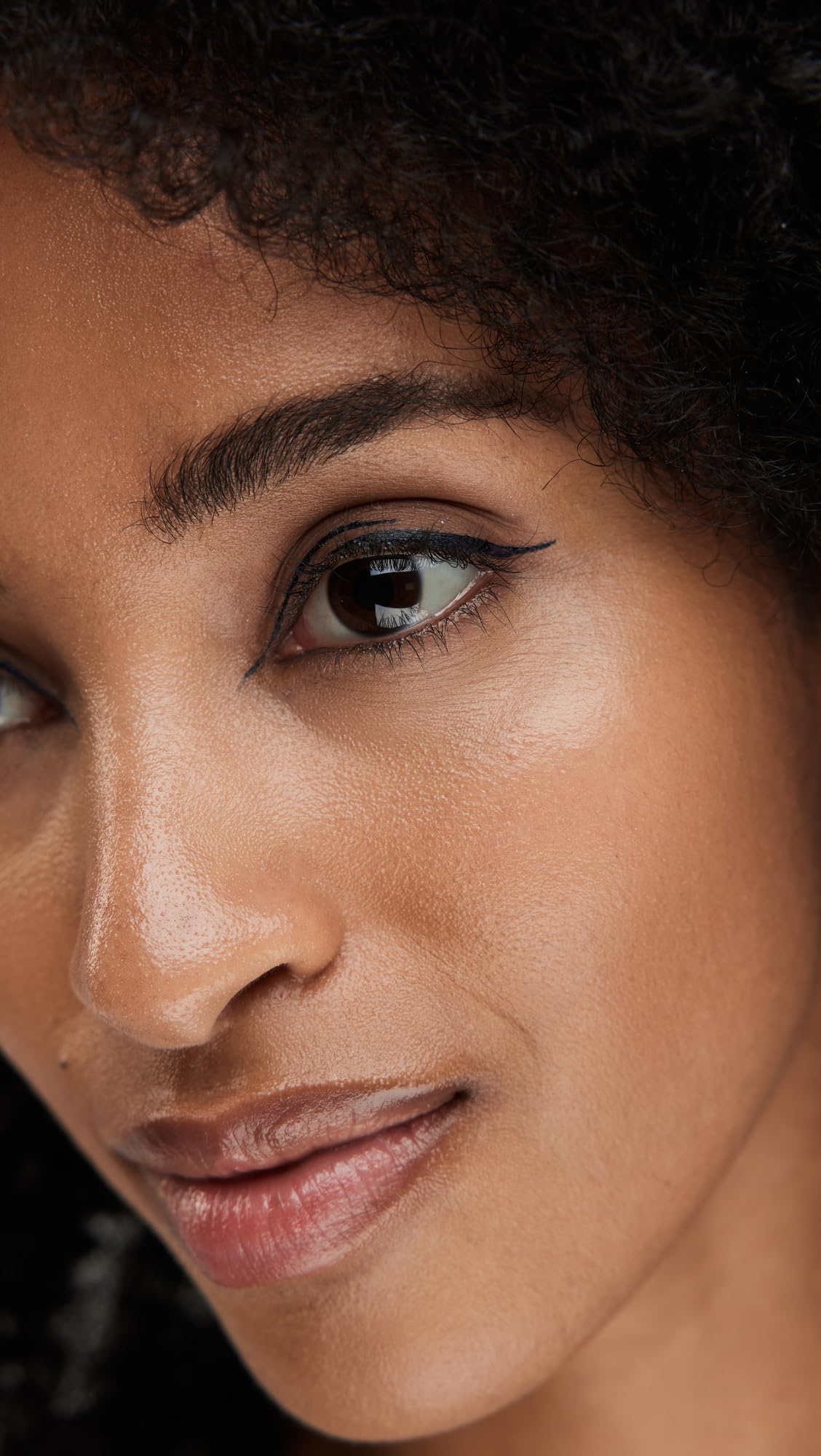 stila swatches of Midnight on skin showing rich deep-blue payoff
