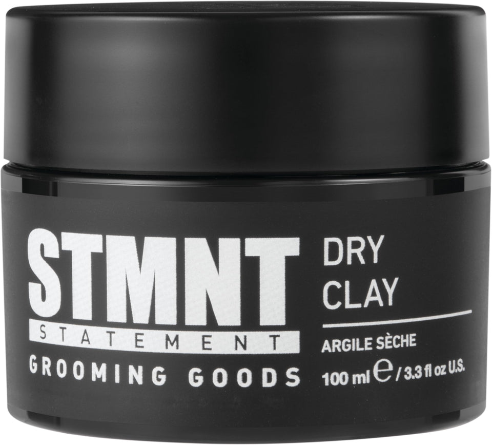 STMNT dry clay front jar showing label and matte packaging benefit: clear product identity