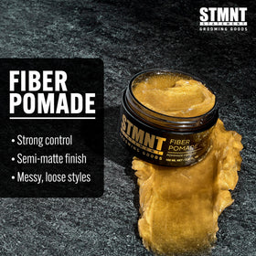 STMNT pomade applied to hands demonstrating smooth spreadability benefit
