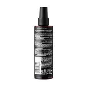 STMNT grooming spray nozzle close-up illustrating fine mist delivery