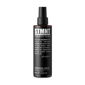 STMNT grooming spray front packaging showing product benefits