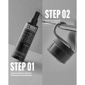 STMNT grooming spray held in hand to show bottle size and scale