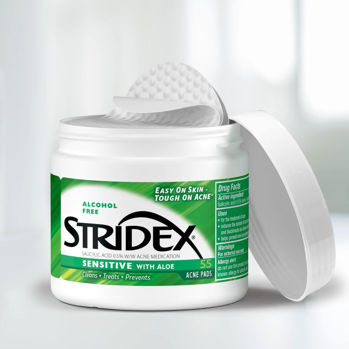 Close-up of textured Stridex pad surface showing fibers and gentle exfoliation - effective cleansing