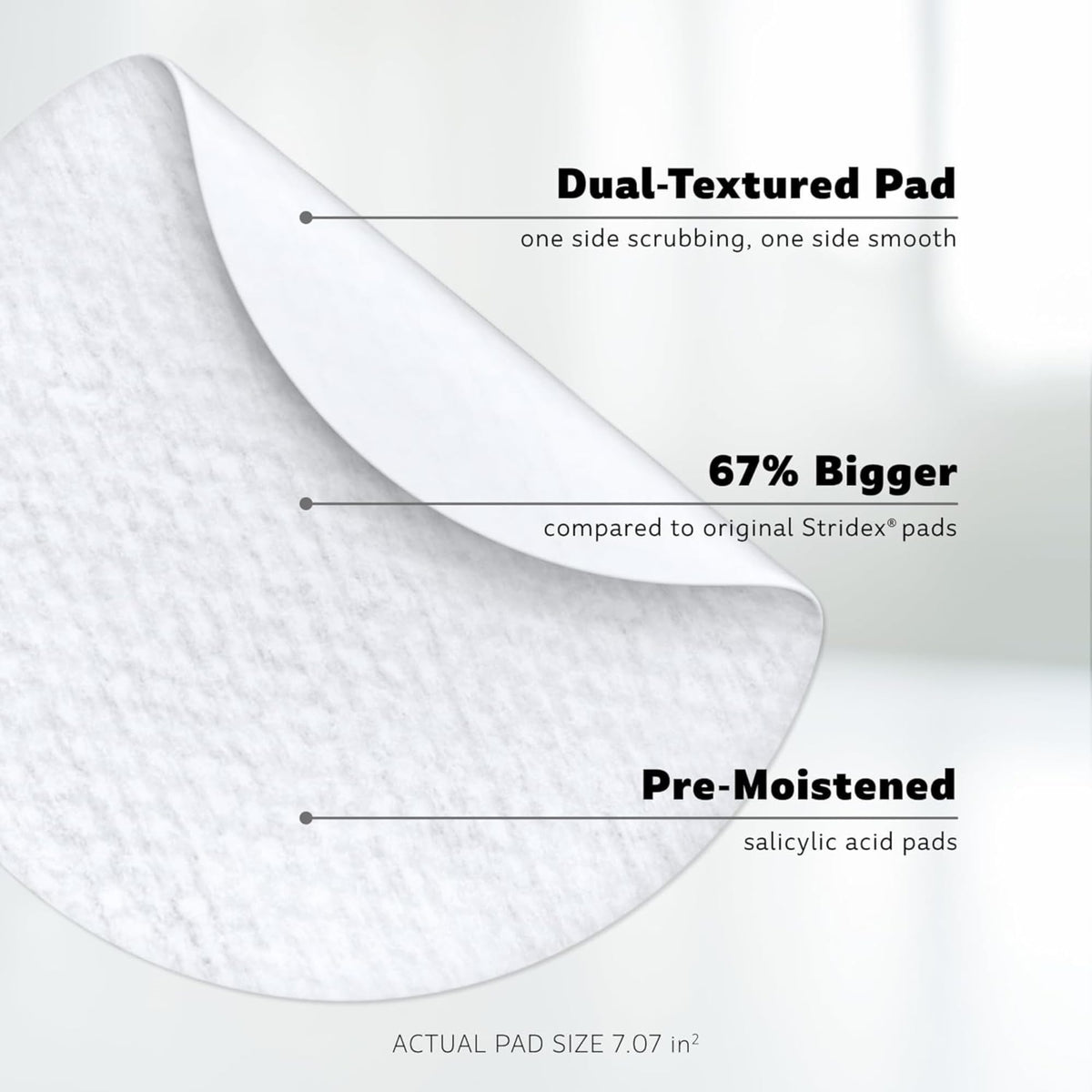 Hand holding Stridex XL pad applying to skin for convenient one-step treatment