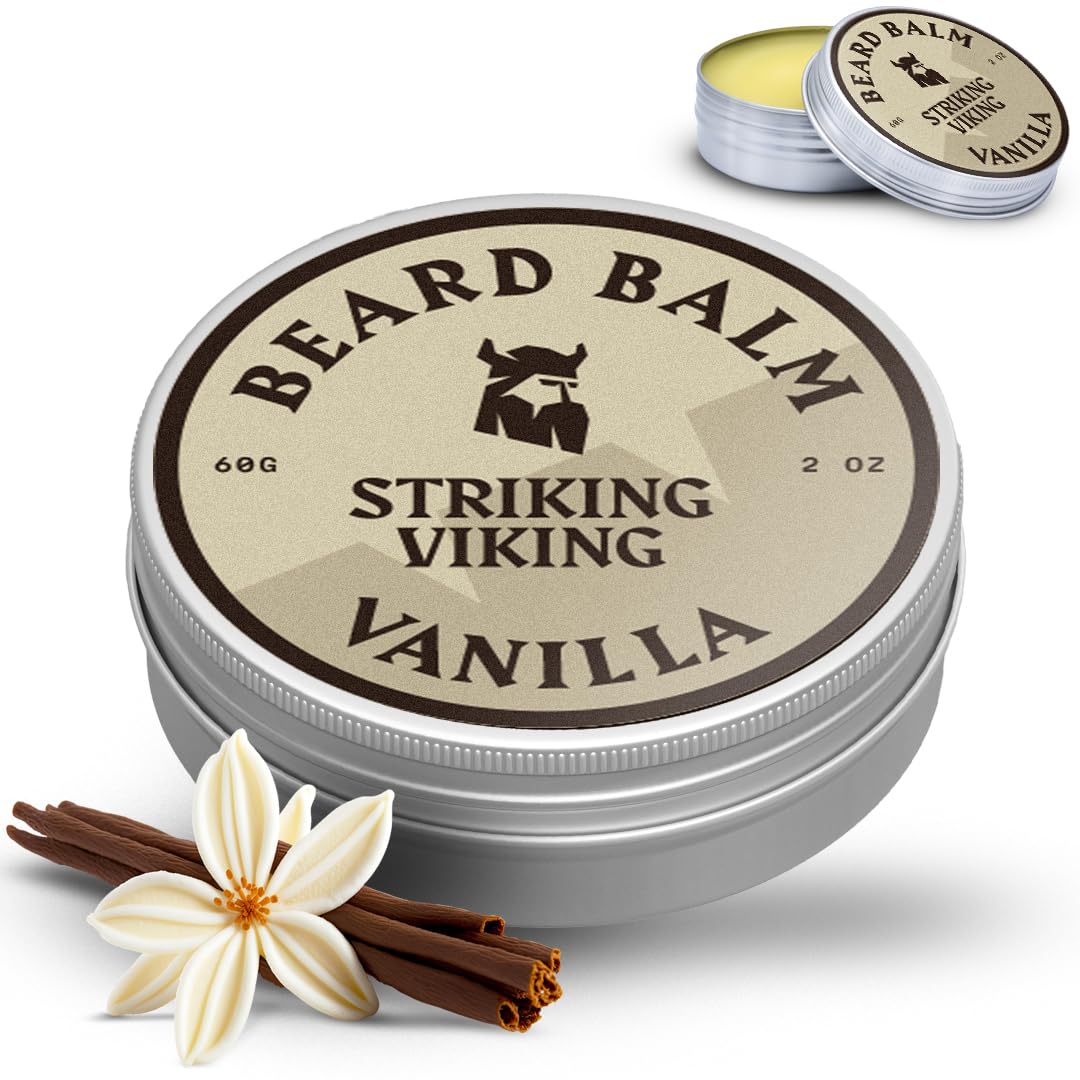striking viking man applying balm outdoors showing natural scent and confidence