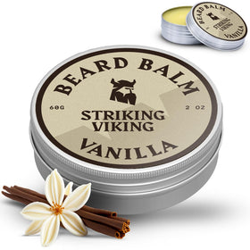 striking viking man applying balm outdoors showing natural scent and confidence