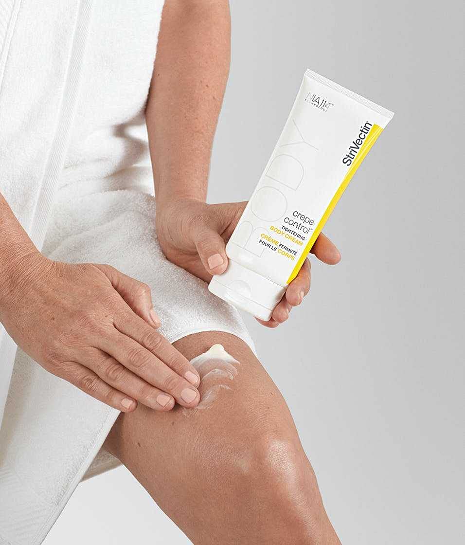 StriVectin cream being smoothed on inner arm to improve crepey texture