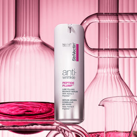 StriVectin bottle on bathroom vanity staged to show everyday skincare routine benefits