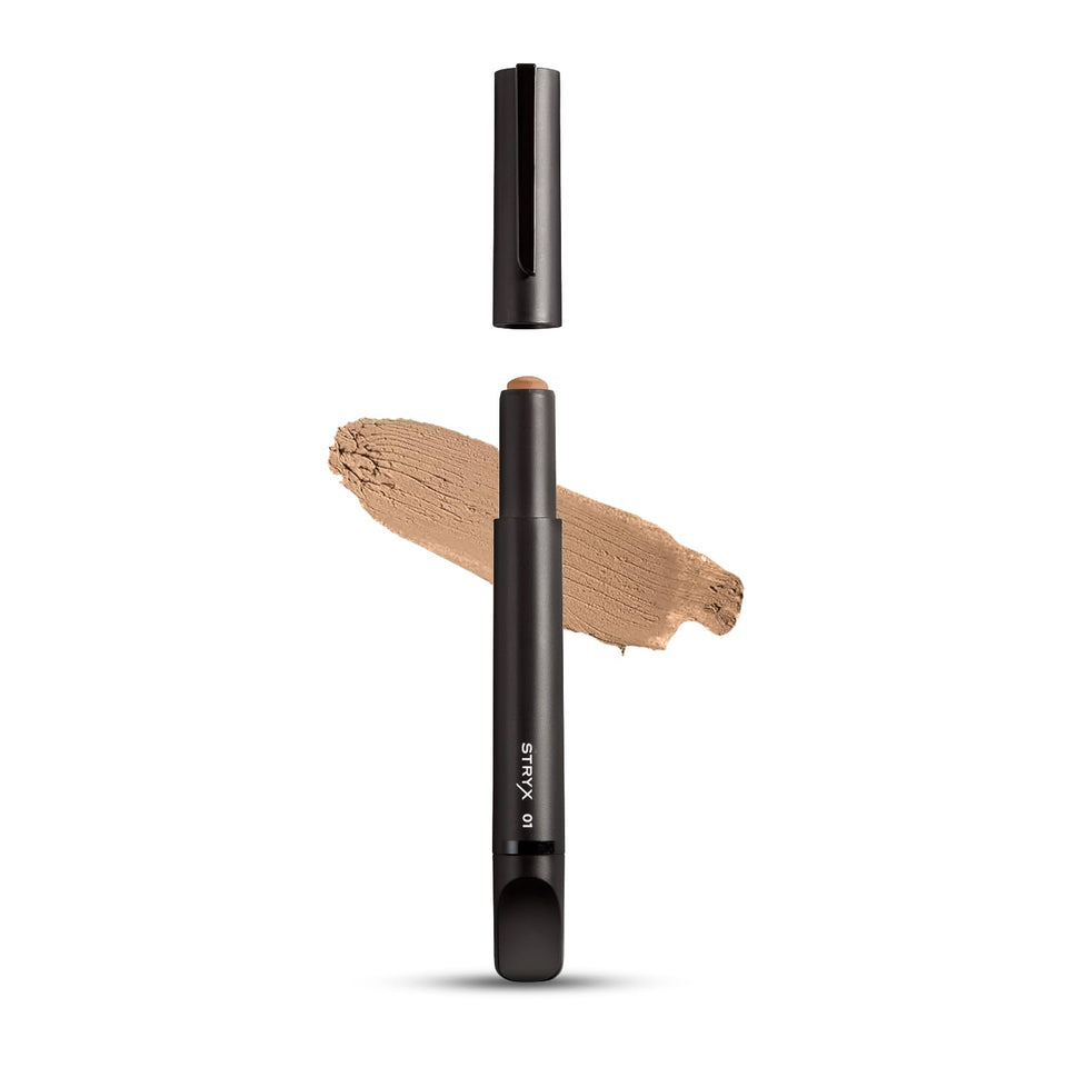 Stryx concealer stick front packaging showing discreet dark tube and shade