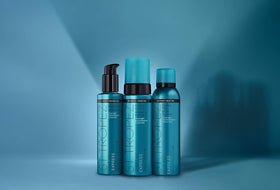 St.Tropez lifestyle image of applying bronzing mist to legs demonstrating quick, all-over tan