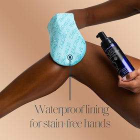 St.Tropez mitt in use applying self-tan mousse for streak-free finish
