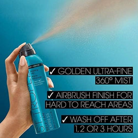St.Tropez close-up of tinted bronzing mist droplets on skin guiding even, streak-free coverage