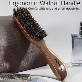 STYLEMATE brush in hand to show size and ergonomic walnut grip convenience