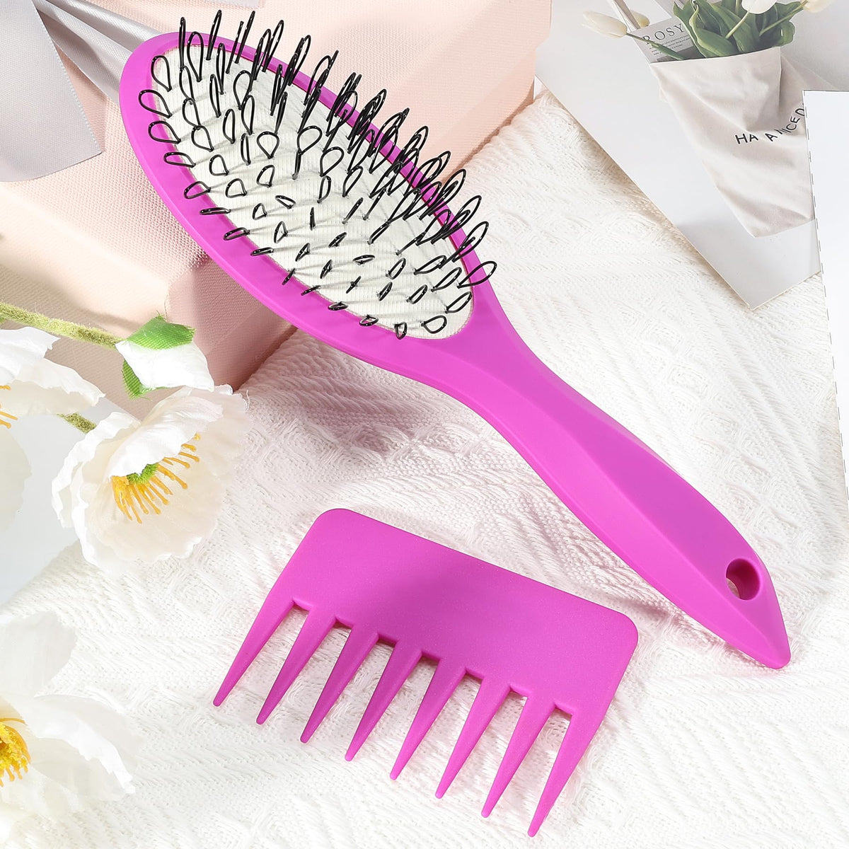 STYLEMATE brush held in hand showing compact travel size and portability
