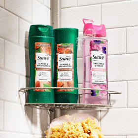 Suave shampoo lathering in shower for gentle cleansing and frizz control