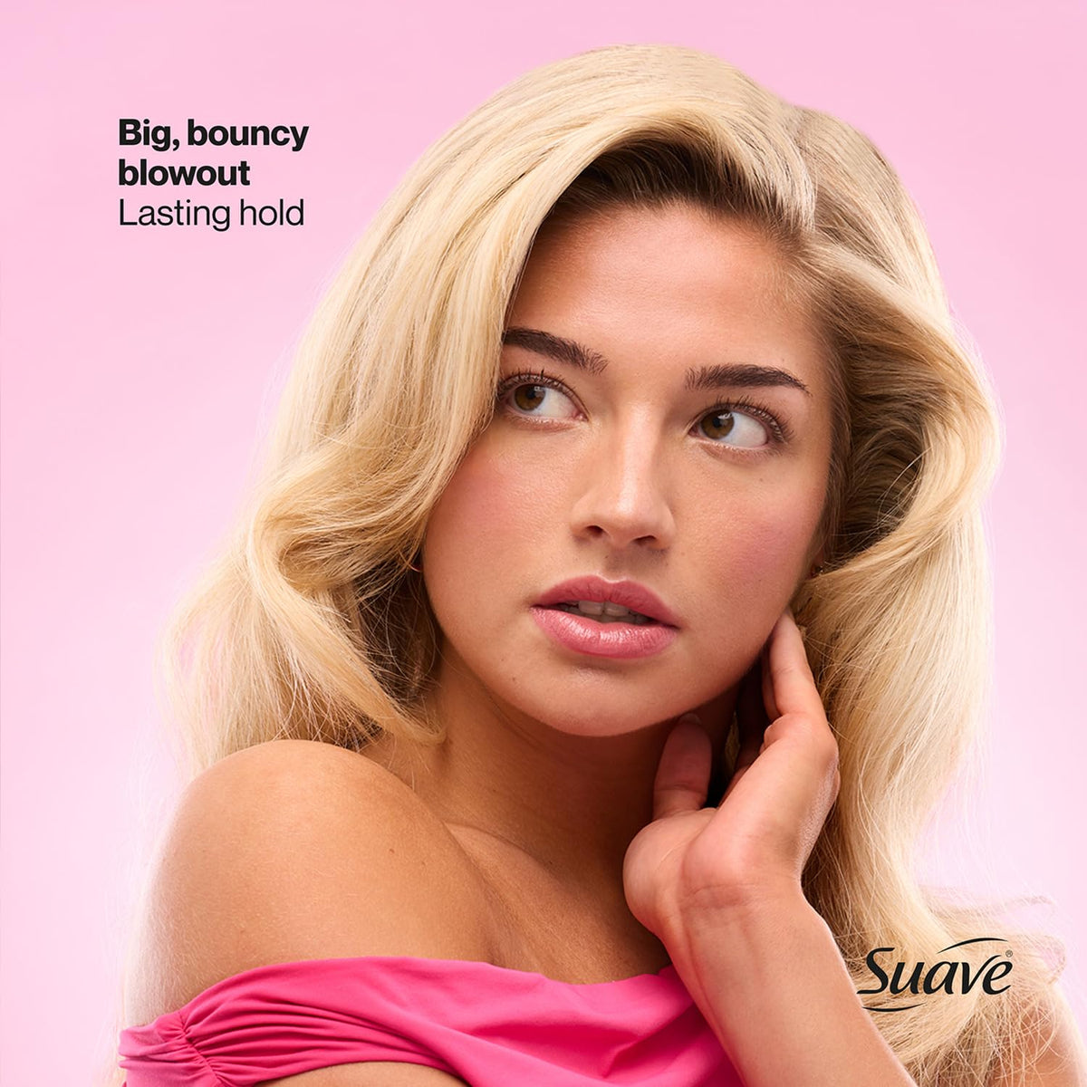 Suave hairspray being sprayed on styled hair demonstrating secure, non-sticky finish