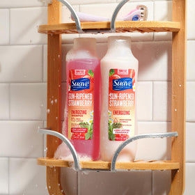 Suave in use on wet hair creating lather that cleanses effectively