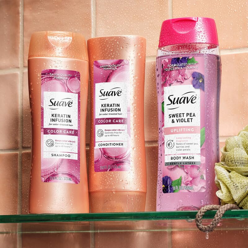 Suave keratin 12.6 oz bottles held in hand showing scale