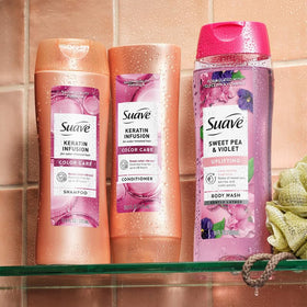 Suave keratin 12.6 oz bottles held in hand showing scale