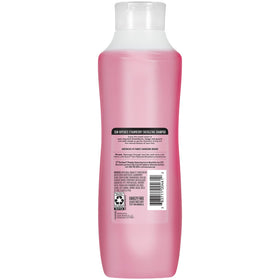 Suave on bathroom shelf in lifestyle scene conveying refreshing, fragrant hair care