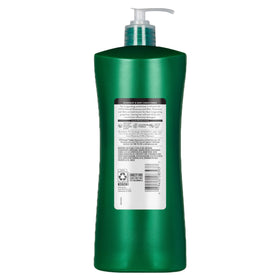 Hand holding Suave bottle to show scale and long-lasting 28 fl oz supply benefit