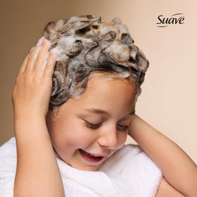 Suave Kids gel texture poured onto hand showing gentle, moisturizing formula