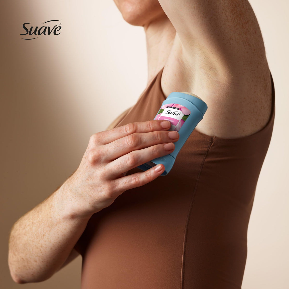 Suave stick inside a purse for scale, demonstrating compact travel-friendly convenience