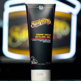8 oz Suavecito gel next to hand showing true size and portability