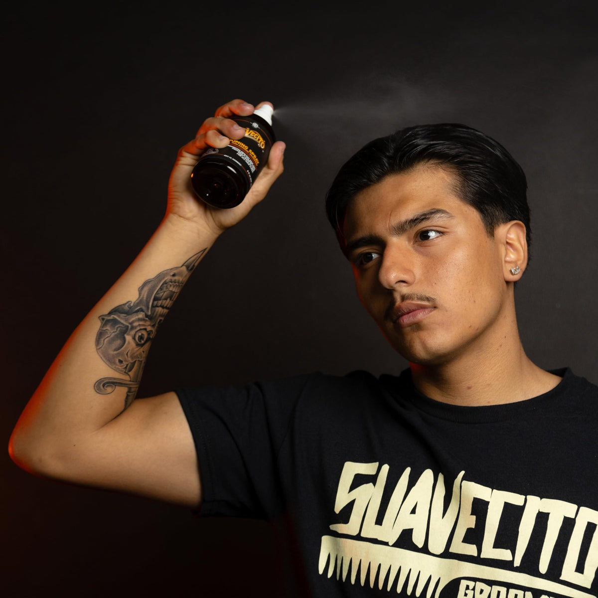 Suavecito used by barber on client showing long-lasting hold benefit