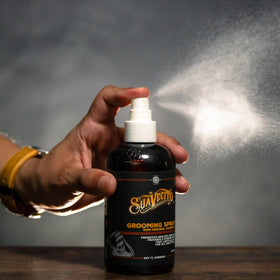Suavecito bottle on dressing table showing polished grooming routine benefit