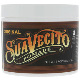Suavecito beside ruler showing 4 oz size for clear scale and value