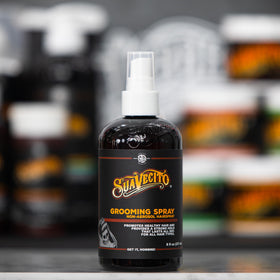 Suavecito bottle in hand for scale showing convenient 8 oz travel benefit