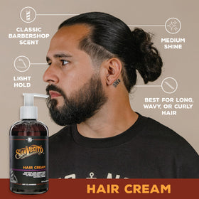 Suavecito 8 oz bottle held in hand illustrating portable size