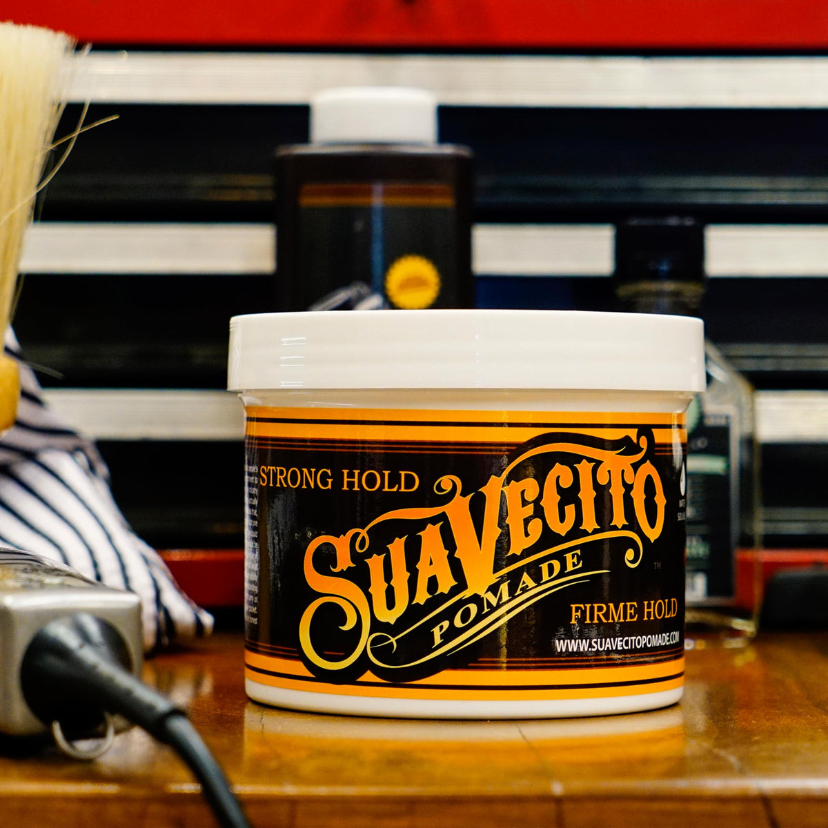 Suavecito rinsing under water showing easy washout and low residue