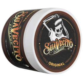 Rinsing Suavecito from hair in sink demonstrating water-based easy washout