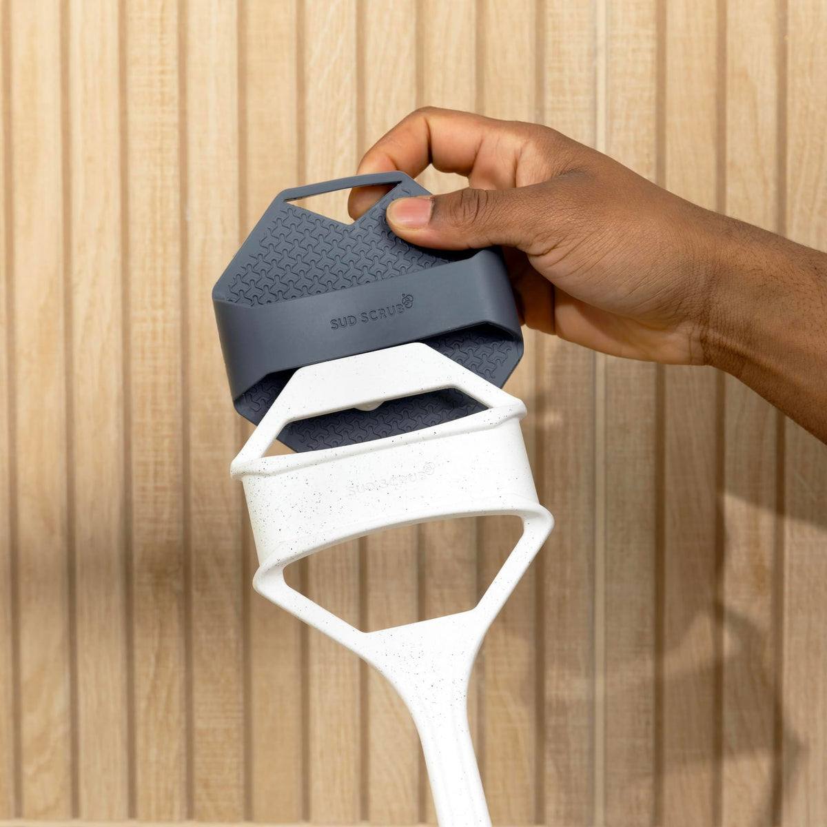 Sud Scrub side profile showing ergonomic curve for reduced wrist strain