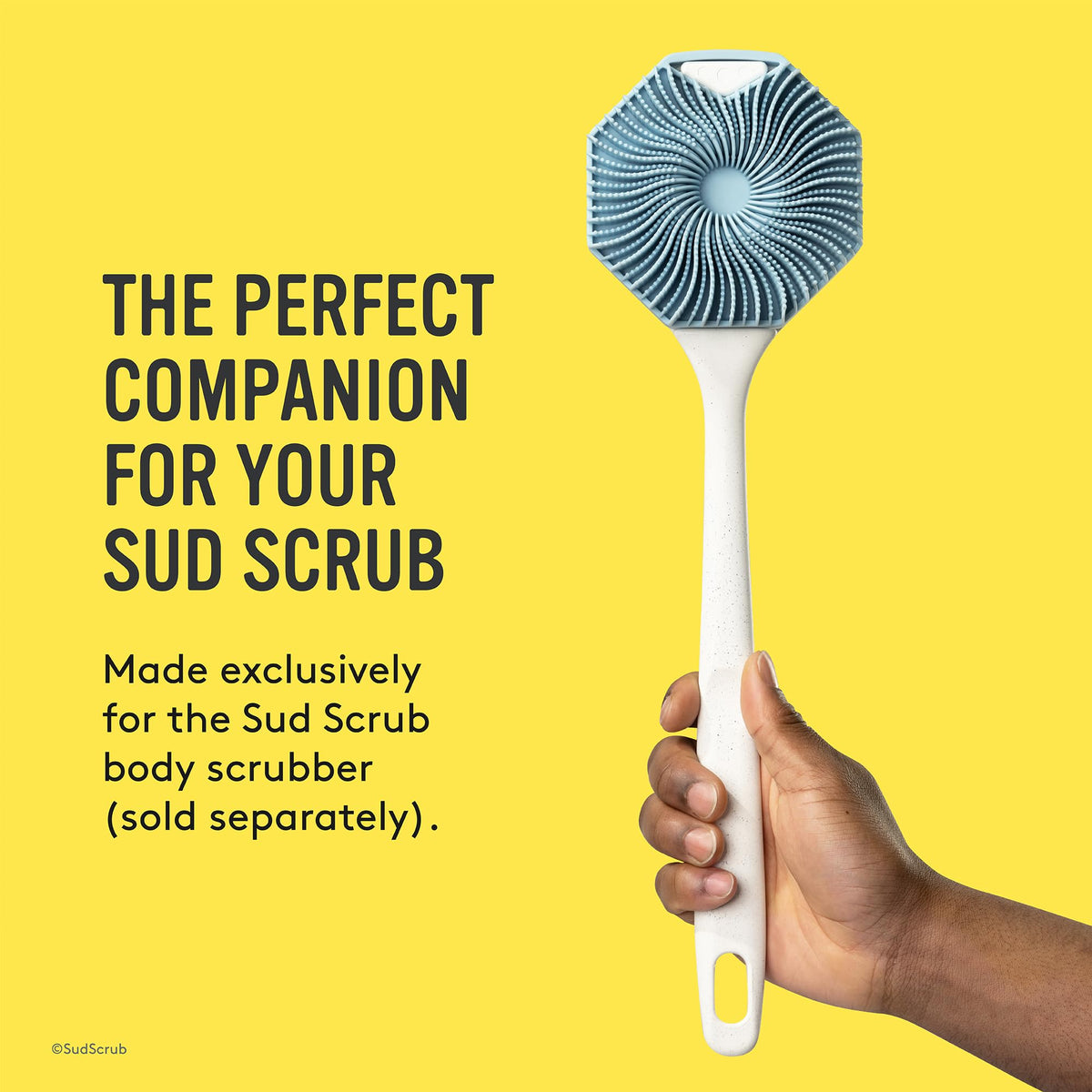 Sud Scrub handle with scrubber attached in shower demonstrating full back coverage