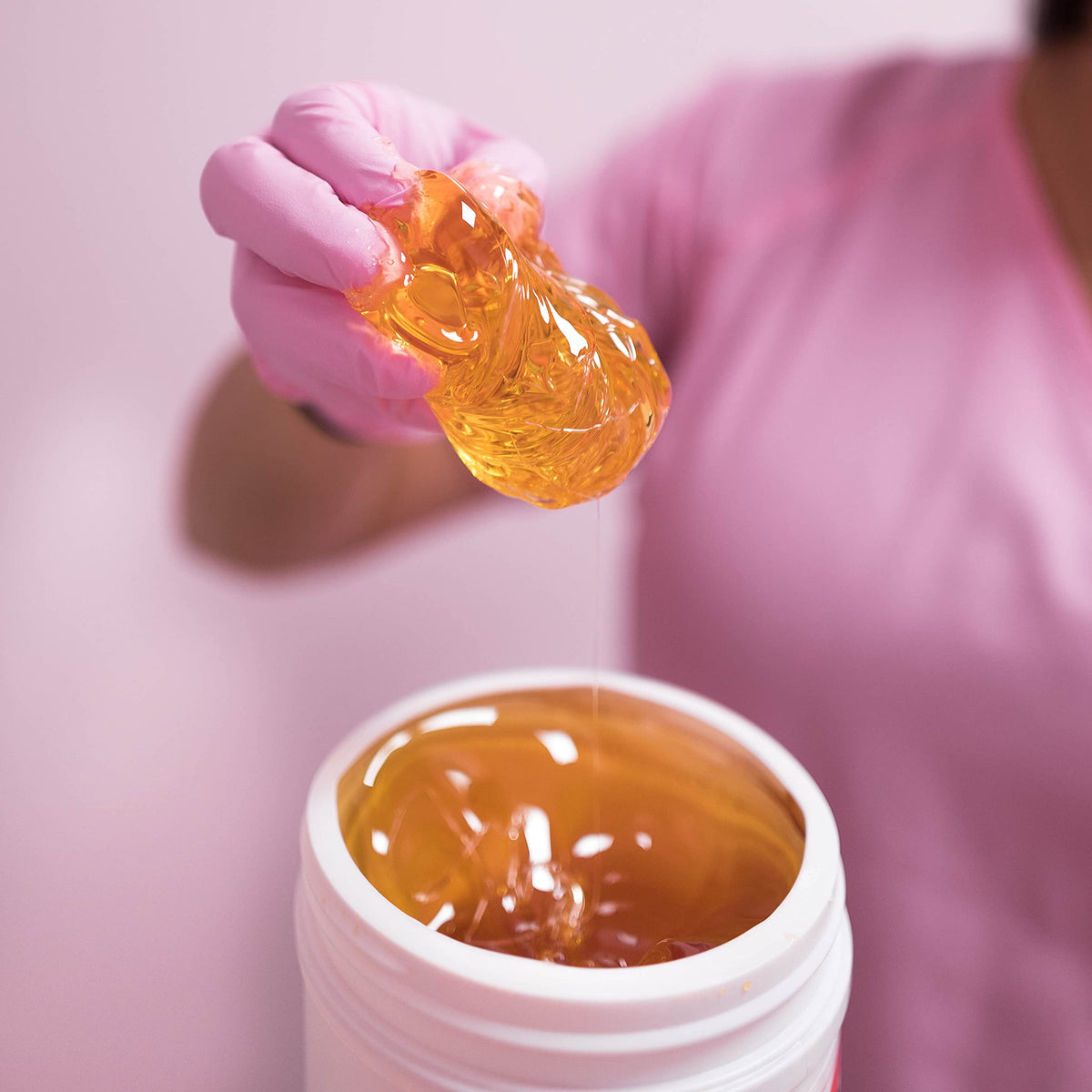Application of Sugaring NYC paste on leg demonstrating effective hair grip and clean removal