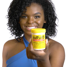 SULFUR8 conditioner applied to hair mid-lengths to demonstrate smoothing benefit