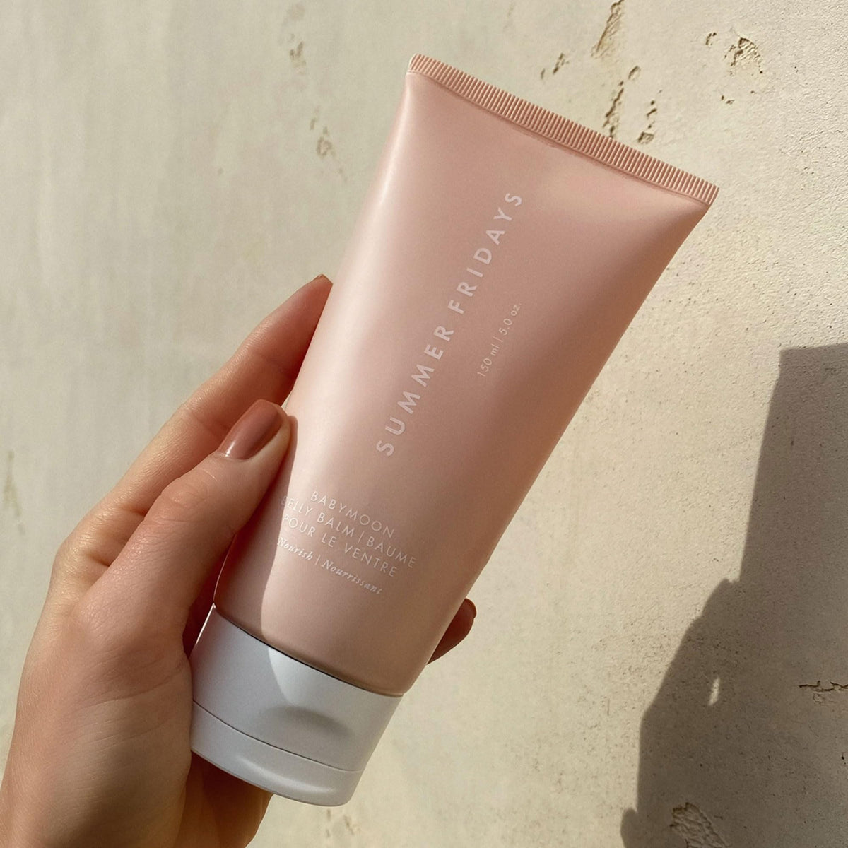 Summer Fridays hand application showing quick absorption and softening effect